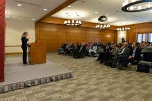 Minister Diaz Perez talking in front of audience