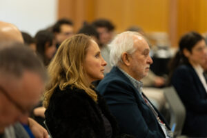 woman and man watching lecture