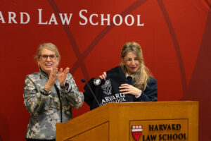 Sharon Block and Minister Diaz holding HLS bag