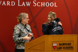 Sharon Block and Minister Diaz holding HLS bag